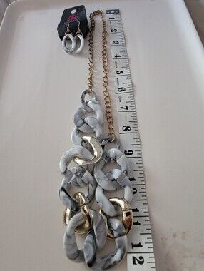 Paparazzi  Necklace and earring set, featuring grey marbled.
